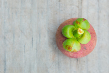Mangosteen thai fruit on wood background