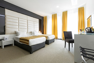 Naklejka na ściany i meble Interior of a modern hotel bedroom
