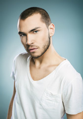 Fototapeta premium Handsome young man in white t-shirt