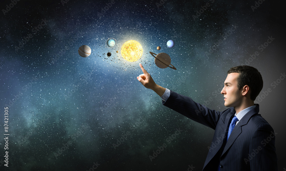 Wall mural man exploring space