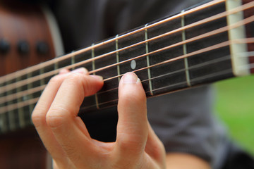 Fototapeta na wymiar playing the guitar / finger board