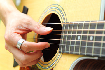 Fototapeta premium Finger picking the guitar