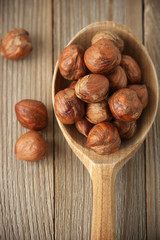 Hazelnuts in wooden spoon