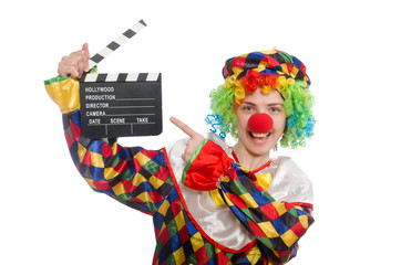 Clown with movie clapper isolated on white