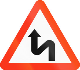 Bangladeshi sign warning about a double curve first to left