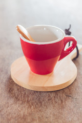 Red mug with wooden plate
