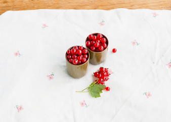 Red currants in green glasses