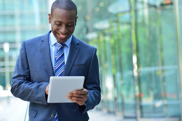 Businessman with digital tablet © stockyimages