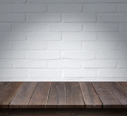 Wood table with White brick wall background