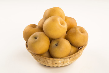 Some asian pears over a wooden surface