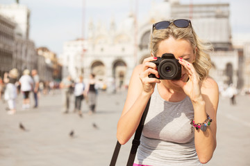 Tourist taking photos in Venice - obrazy, fototapety, plakaty