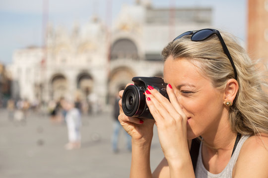 Girl taking photos with digital camera