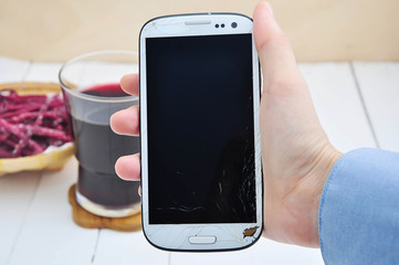 hand showing cell phone.