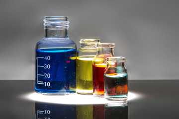 Set of laboratory bottles with color liquid