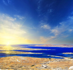 Fototapeta premium A panorama of sunset over Delos island, Greece with a shipwreck on the sandy beach