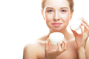 Beautiful spa girl holding jar of cream 