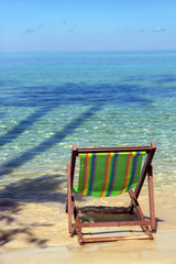 empty beach chairs by the sea