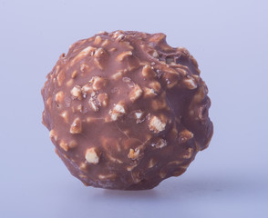 chocolate ball or chocolate bonbon on a background.