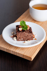 chocolate pie with nuts, decorated mint