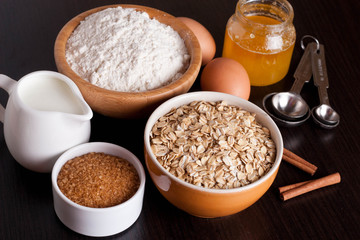 oatmeal, flour, milk and eggs - the ingredients for baking cooki