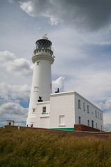 White lighthouse on Flamborough Head in England.