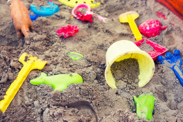 Plastic children toys in sandpit or on a beach