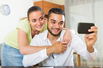 Fototapeta premium Man and woman posing for a selfie
