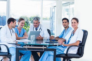 Team of smiling doctors having a meeting