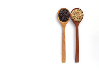 Rice and wooden spoon with space on white background