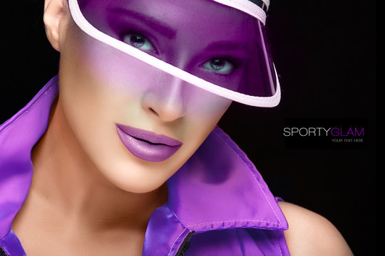 Sporty Beauty. Fashionable Young Woman in Purple Sun Visor