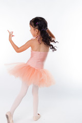 Naklejka premium A little ballerina in the studio. On White Background