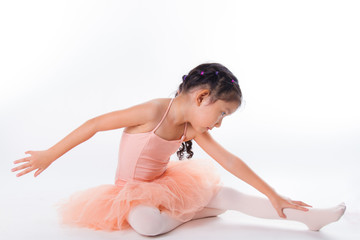 Obraz premium A little ballerina in the studio. On White Background
