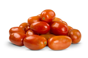 Some tomatoes over a wooden surface on a tomato field as backgro