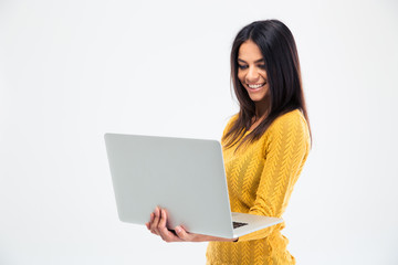 Happy beautiful woman using laptop