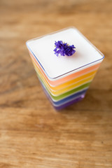 Rainbow Jelly on Wooden Background