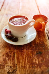 Cup of coffee on a wooden background
