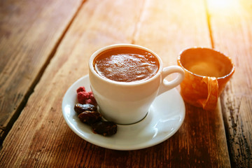 Cup of coffee on a wooden background