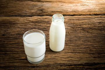fresh milk in glass bottle and glass