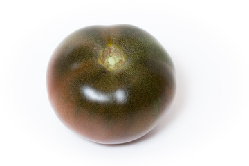 Tomato kumato isolated on white background.