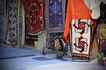 Vintage Bicycle parked in front of a rug store in the Athens flea markets