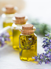 Wellness treatments with lavender flowers on wooden table. Spa still-life.