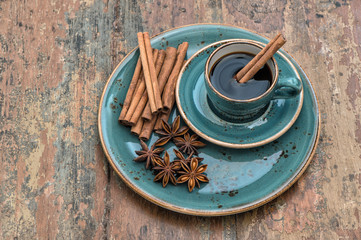Black coffee with cinnamon and star anise spices. Vintage still