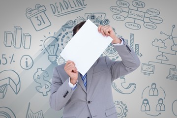 Composite image of businessman holding blank sign in front