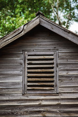 Closeup image of top of wooden house with vintage roof 