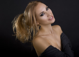 Beautiful Sexy Blond Smiling Woman. Dark Background. Smokey Eyes