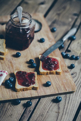 Toast bread with wild strawberry jam. Retro,vintage filter