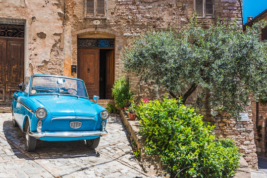 Old Blue means of transport in the medieval town in Italy