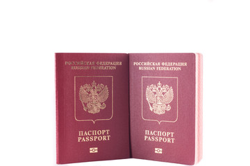 Two passports red colour with a Golden eagle emblem