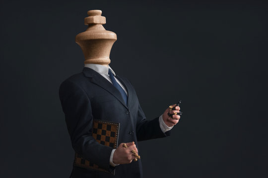 Symbol of a narcissist without head and with pawns in the hands