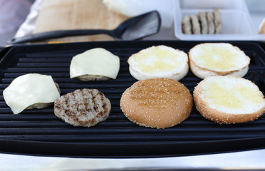 Beef and  bread grilling outdoors